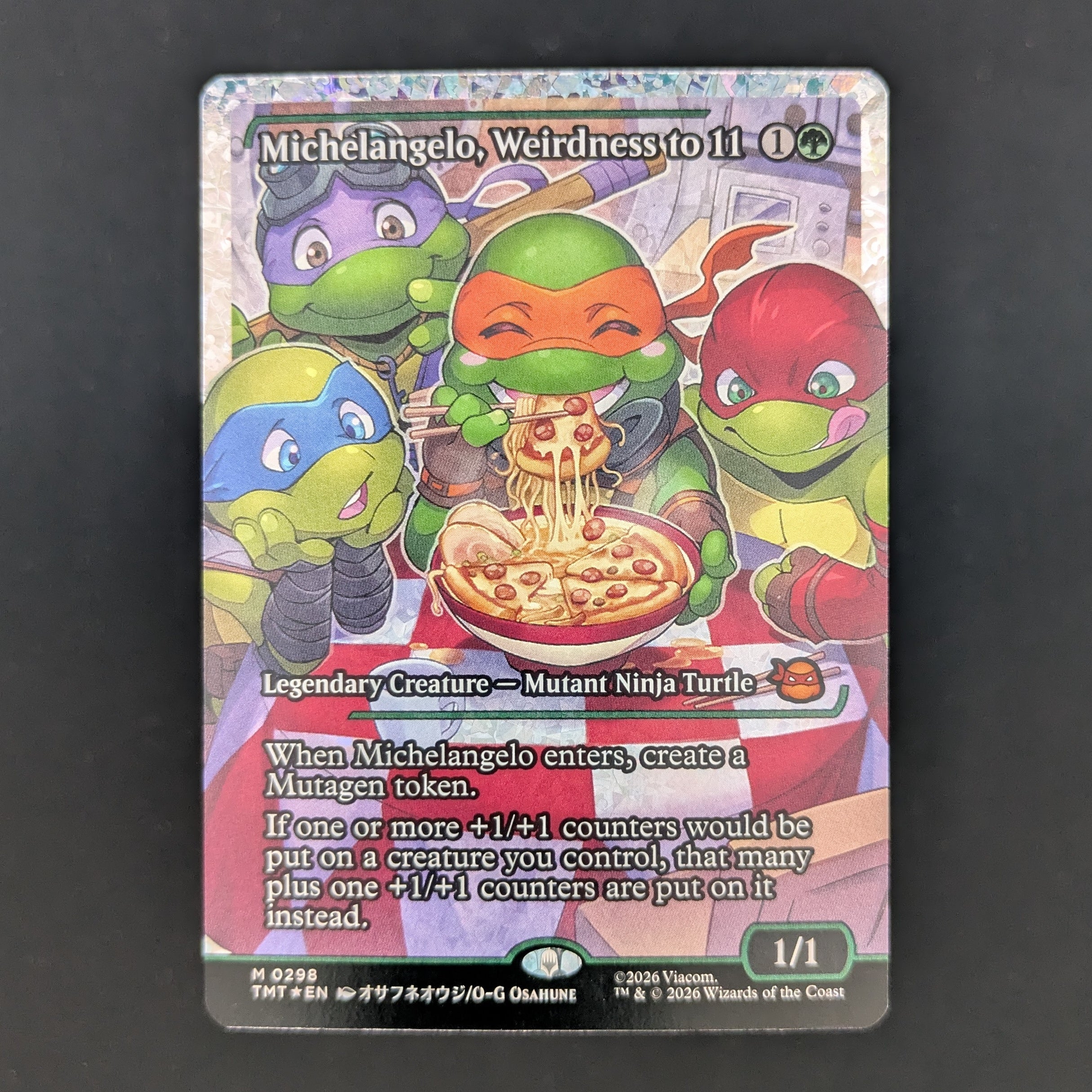 [FOIL] Michelangelo, Weirdness to 11 (Showcase) (Fracture Foil) - Teenage Mutant Ninja Turtles: Extras - English - NM