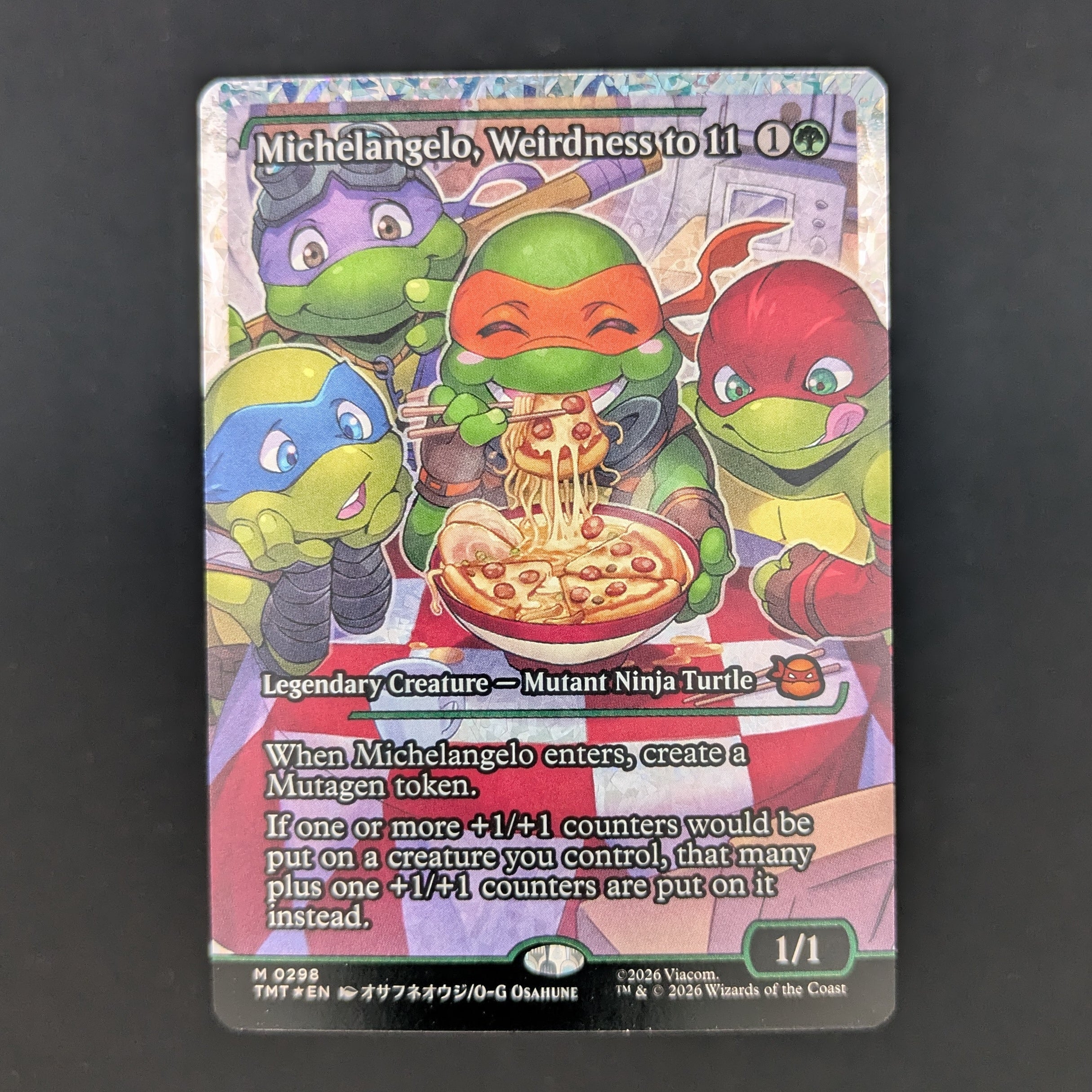 [FOIL] Michelangelo, Weirdness to 11 (Showcase) (Fracture Foil) - Teenage Mutant Ninja Turtles: Extras - English - NM